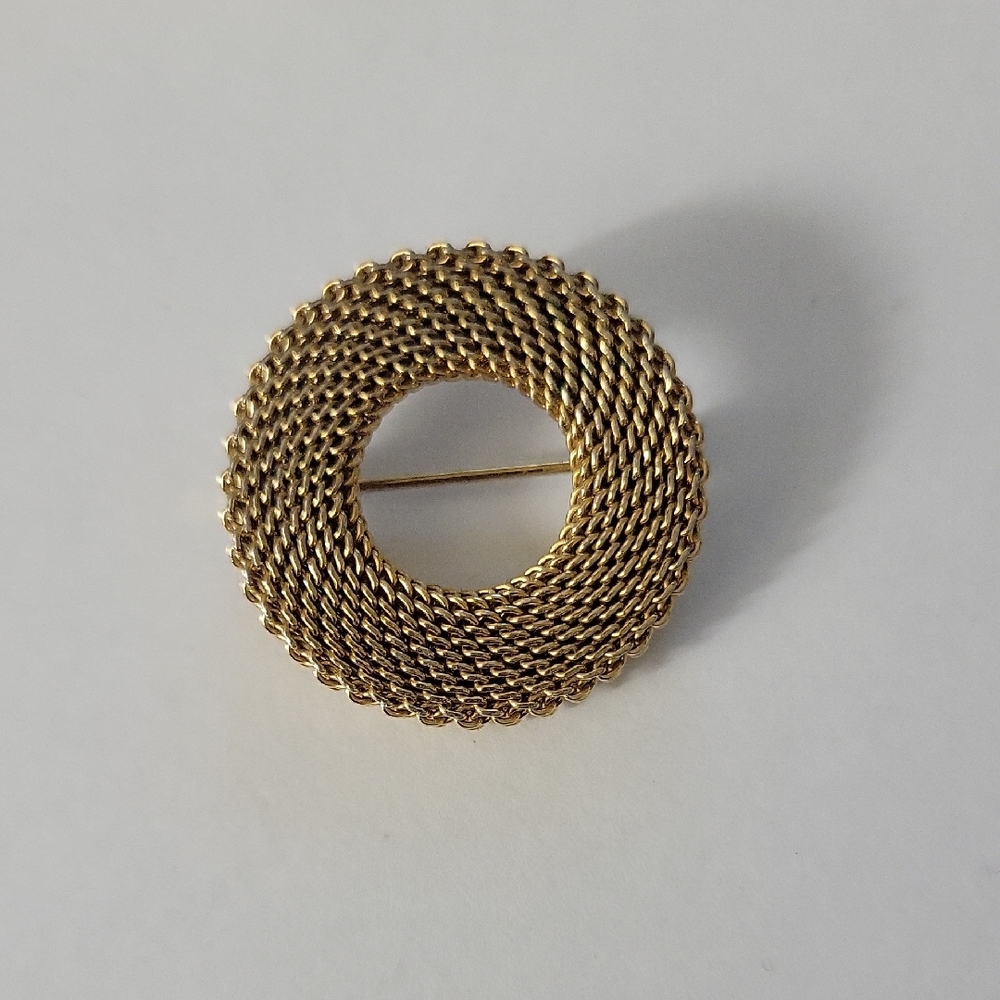 Elegant Gold-Tone Circular Brooch